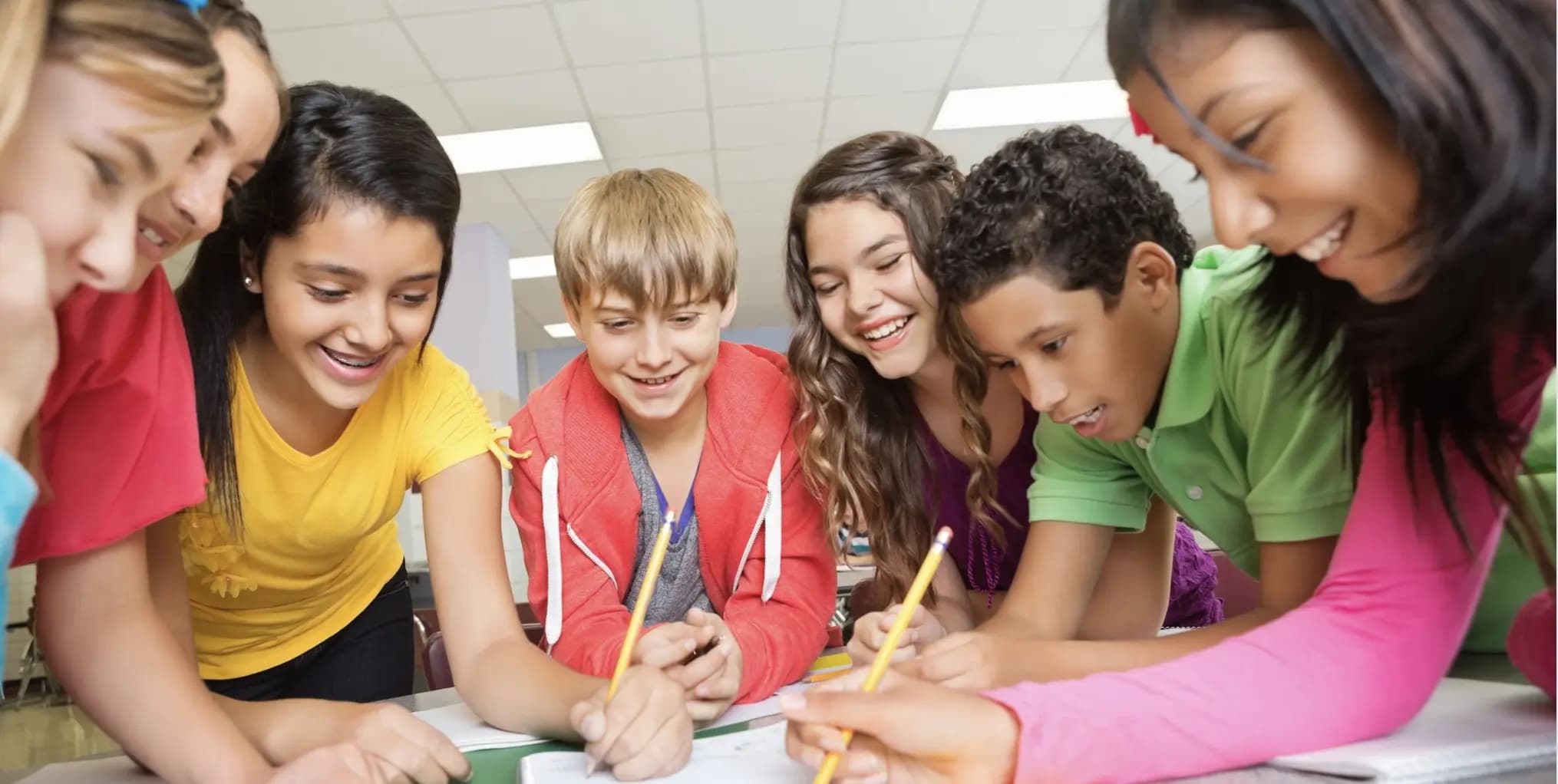 A group of students collaborating around a table