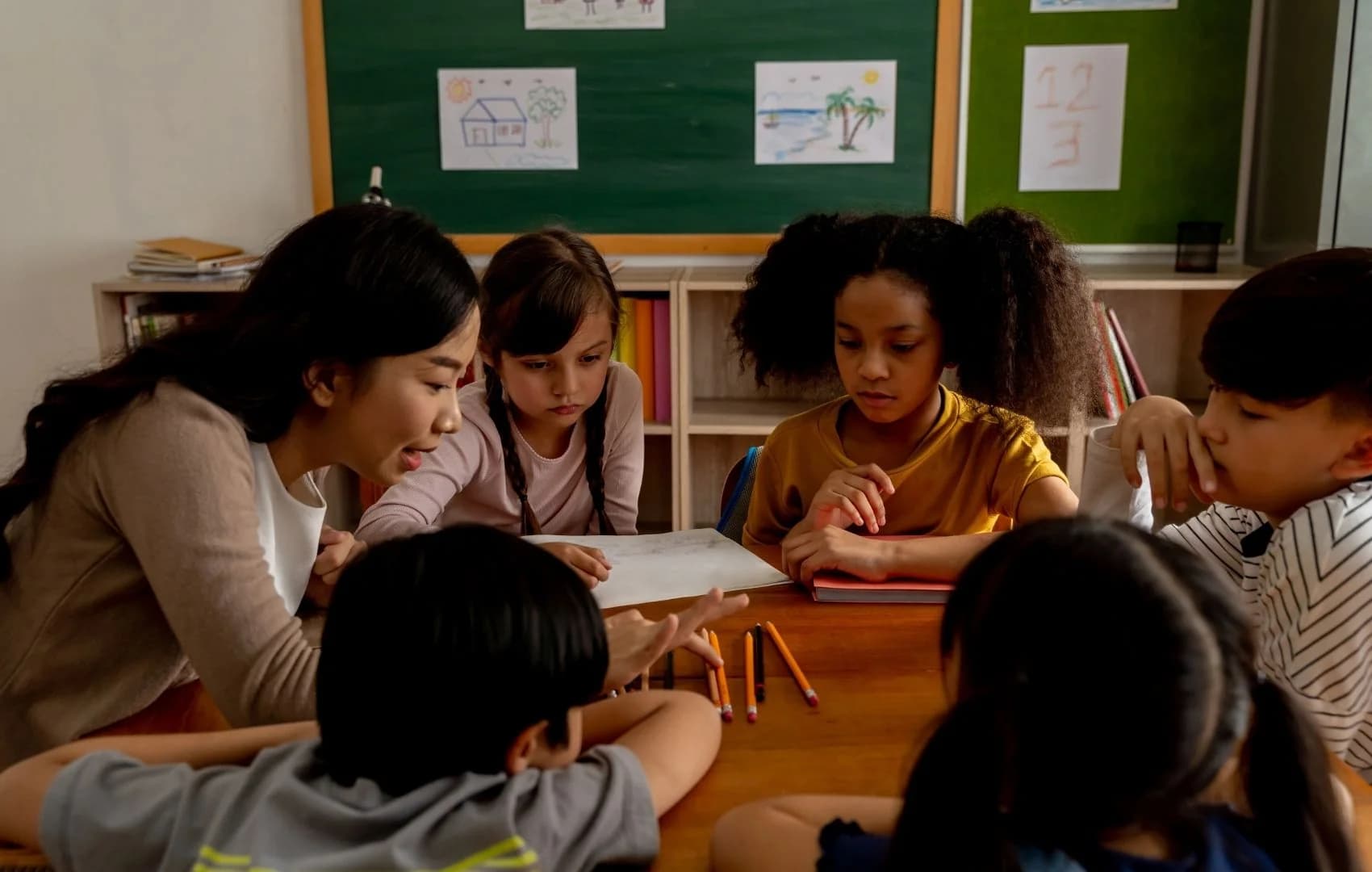 A small group solving problems around a table